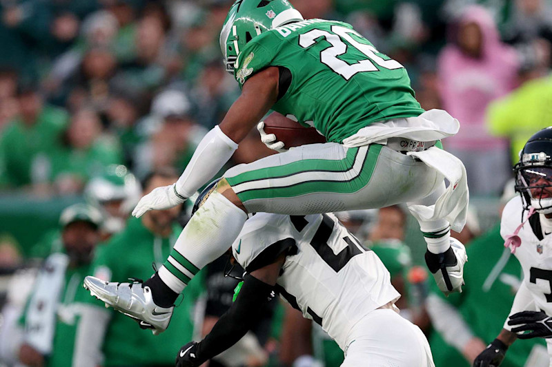 PHILADELPHIA, PENNSYLVANIA - NOVEMBER 03: Saquon Barkley #26 of the Philadelphia Eagles reverse hurdles over Jarrian Jones #22 of the Jacksonville Jaguars in the second quarter at Lincoln Financial Field on November 03, 2024 in Philadelphia, Pennsylvania. (Photo by Elsa/Getty Images)