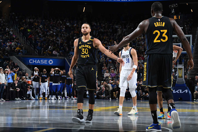 SAN FRANCISCO, CA - NOVEMBER 12: Stephen Curry #30 and Draymond Green #23 of the Golden State Warriors high five during the game against the Dallas Mavericks during the Emirates NBA Cup game on November 12, 2024 at Chase Center in San Francisco, California. NOTE TO USER: User expressly acknowledges and agrees that, by downloading and or using this photograph, user is consenting to the terms and conditions of Getty Images License Agreement. Mandatory Copyright Notice: Copyright 2024 NBAE (Photo by Noah Graham/NBAE via Getty Images)