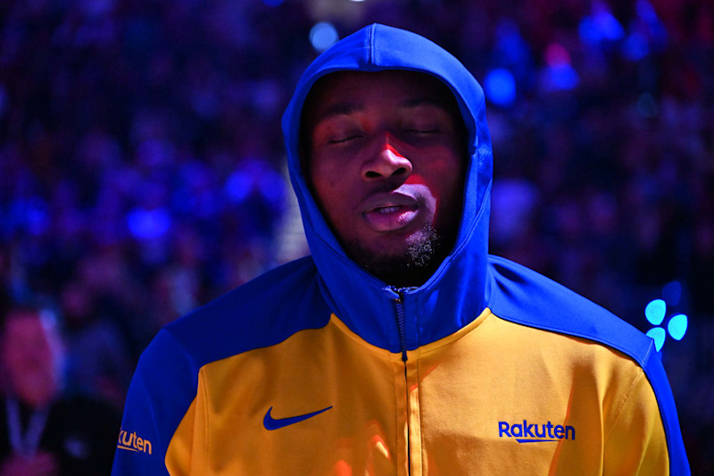 CLEVELAND, OHIO - NOVEMBER 08: Jonathan Kuminga #00 of the Golden State Warriors listens to the national anthem prior to the game against the Cleveland Cavaliers at Rocket Mortgage Fieldhouse on November 08, 2024 in Cleveland, Ohio. NOTE TO USER: User expressly acknowledges and agrees that, by downloading and or using this photograph, User is consenting to the terms and conditions of the Getty Images License Agreement. (Photo by Jason Miller/Getty Images)