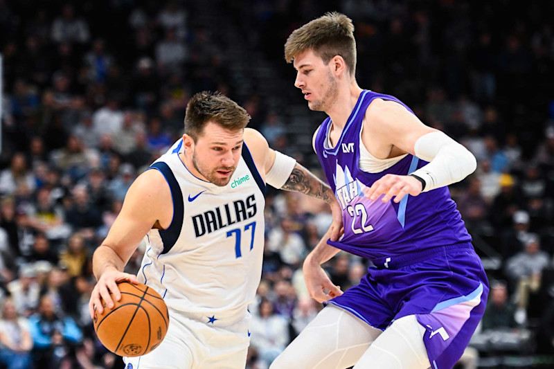 SALT LAKE CITY, UTAH - NOVEMBER 14: Luka Doncic #77 of the Dallas Mavericks drives into Kyle Filipowski #22 of the Utah Jazz during the first half of a game at Delta Center on November 14, 2024 in Salt Lake City, Utah. NOTE TO USER: User expressly acknowledges and agrees that, by downloading and or using this photograph, User is consenting to the terms and conditions of the Getty Images License Agreement.  (Photo by Alex Goodlett/Getty Images)