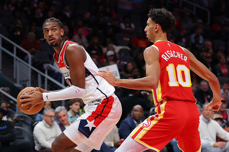 ATLANTA, GEORGIA - OCTOBER 28:  Alexandre Sarr #20 of the Washington Wizards turns to shoot against Zaccharie Risacher #10 of the Atlanta Hawks during the second quarter at State Farm Arena on October 28, 2024 in Atlanta, Georgia.  NOTE TO USER: User expressly acknowledges and agrees that, by downloading and/or using this photograph, user is consenting to the terms and conditions of the Getty Images License Agreement.  (Photo by Kevin C. Cox/Getty Images)