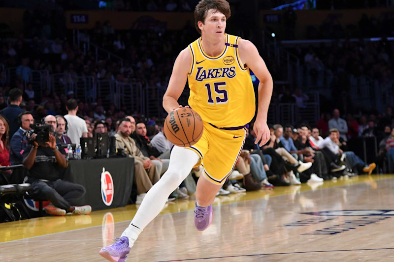 LOS ANGELES, CA - OCTOBER 22:  Austin Reaves #15 of the Los Angeles Lakers drives to the basket during the game against the Memphis Grizzlies on October 22, 2024 at Crypto.com Arena in Los Angeles, California. NOTE TO USER: User expressly acknowledges and agrees that, by downloading and/or using this Photograph, user is consenting to the terms and conditions of the Getty Images License Agreement. Mandatory Copyright Notice: Copyright 2024 NBAE (Photo by Juan Ocampo/NBAE via Getty Images)