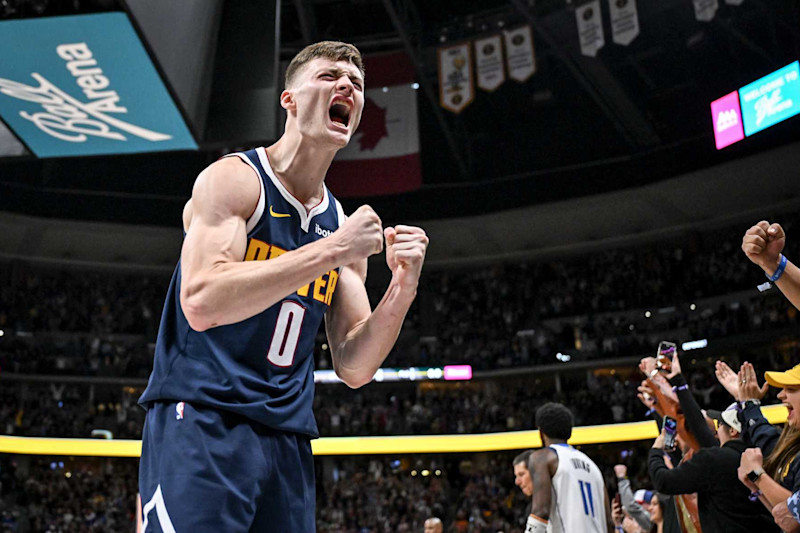 DENVER, CO - NOVEMBER 10: Christian Braun (0) of the Denver Nuggets celebrates forcing a miss from Kyrie Irving (11) of the Dallas Mavericks to end the game during the fourth quarter of the Nuggets' 122-120 win at Ball Arena in Denver, Colorado on Sunday, November 10, 2024. (Photo by AAron Ontiveroz/The Denver Post)