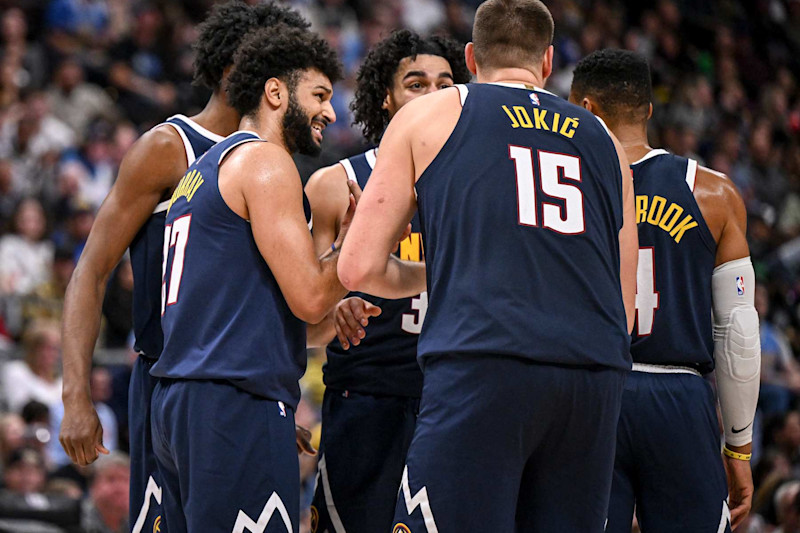 DENVER, CO - NOVEMBER 10: Jamal Murray (27) and Nikola Jokic (15) of the Denver Nuggets talk to teammates Peyton Watson (8), Julian Strawther (3) and Russell Westbrook (4) before a resumption of play against the Dallas Mavericks during the fourth quarter of the Nuggets' 122-120 win at Ball Arena in Denver, Colorado on Sunday, November 10, 2024. (Photo by AAron Ontiveroz/The Denver Post)