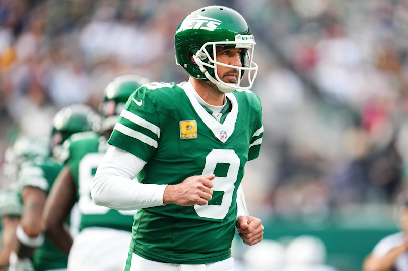 EAST RUTHERFORD, NJ - NOVEMBER 17: Aaron Rodgers #8 of the New York Jets looks on from the field during an NFL football game against the Indianapolis Colts at MetLife Stadium on November 17, 2024 in East Rutherford, New Jersey. (Photo by Cooper Neill/Getty Images)