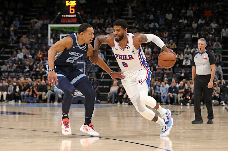 MEMPHIS, TENNESSEE - NOVEMBER 20: Paul George #8 of the Philadelphia 76ers drives to the basket against Desmond Bane #22 of the Memphis Grizzlies during the first half at FedExForum on November 20, 2024 in Memphis, Tennessee. NOTE TO USER: User expressly acknowledges and agrees that, by downloading and or using this photograph, User is consenting to the terms and conditions of the Getty Images License Agreement. (Photo by Justin Ford/Getty Images)