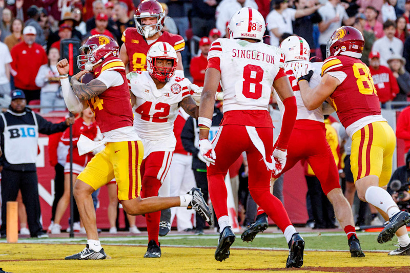 LOS ANGELES, CA - NOVEMBER 16, 2024: *USC Trojans quarterback Jayden Maiava (14) scores on a quarterback-keeper play in front of Nebraska Cornhuskers linebacker Mikai Gbayor (42) in the fourth quarter on November 16, 2024 in Los Angeles, California. (Gina Ferazzi / Los Angeles Times via Getty Images)