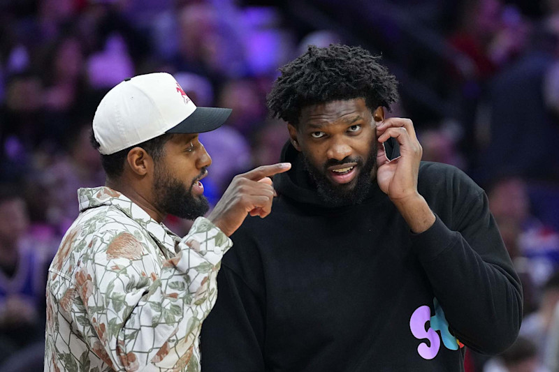 PHILADELPHIA, PENNSYLVANIA - NOVEMBER 2: Paul George #8 of the Philadelphia 76ers talks to Joel Embiid #21 during a timeout in the game against the Memphis Grizzlies in the first half at the Wells Fargo Center on November 2, 2024 in Philadelphia, Pennsylvania. NOTE TO USER: User expressly acknowledges and agrees that, by downloading and/or using this photograph, user is consenting to the terms and conditions of the Getty Images License Agreement. (Photo by Mitchell Leff/Getty Images)