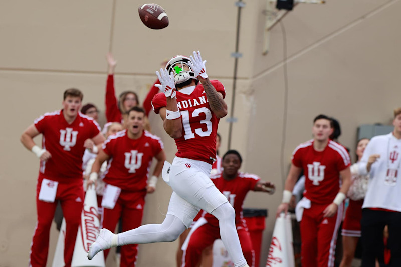 BLOOMINGTON, INDIANA, UNITED STATES - 2024/11/09: Indiana Hoosiers wide receiver Elijah Sarratt (13) makes a touchdown catch during an NCAA football game against Michigan in Bloomington, Ind. Indiana beat Michigan 20-15. (Photo by Jeremy Hogan/SOPA Images/LightRocket via Getty Images)