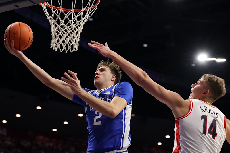 TUCSON, ARIZONA - NOVEMBER 22: Cooper Flagg #2 of the Duke Blue Devils attempts a layup against Motiejus Krivas #14 of the Arizona Wildcats during the second half at McKale Center on November 22, 2024 in Tucson, Arizona. (Photo by Chris Coduto/Getty Images)