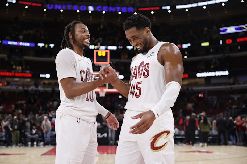 CHICAGO, ILLINOIS - NOVEMBER 11: Darius Garland (L) #10 of the Cleveland Cavaliers and Donovan Mitchell #45 of the Cleveland Cavaliers celebrate their win over the Chicago Bulls at the United Center on November 11, 2024 in Chicago, Illinois. NOTE TO USER: User expressly acknowledges and agrees that, by downloading and or using this photograph, User is consenting to the terms and conditions of the Getty Images License Agreement. (Photo by Geoff Stellfox/Getty Images)