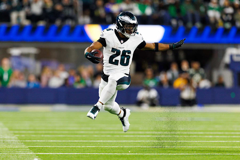 INGLEWOOD, CALIFORNIA - NOVEMBER 24: Saquon Barkley #26 of the Philadelphia Eagles runs with the ball during the first half against the Los Angeles Rams at SoFi Stadium on November 24, 2024 in Inglewood, California. (Photo by Ric Tapia/Getty Images)