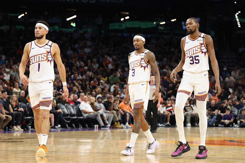 PHOENIX, ARIZONA - OCTOBER 28: (L-R) Devin Booker #1, Bradley Beal #3 and Kevin Durant #35 of the Phoenix Suns walk on the court during the first half of the NBA game against the Los Angeles Lakers at Footprint Center on October 28, 2024 in Phoenix, Arizona.  The Suns defeated the Lakers 109-105.  NOTE TO USER: User expressly acknowledges and agrees that, by downloading and/or using this photograph, user is consenting to the terms and conditions of the Getty Images License Agreement. (Photo by Christian Petersen/Getty Images)