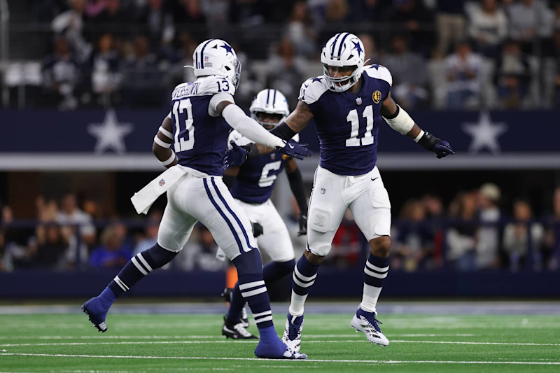 ARLINGTON, TEXAS - NOVEMBER 28: DeMarvion Overshown #13 and Micah Parsons #11 of the Dallas Cowboys celebrate after a defense play during the second quarter against the New York Giants at AT&T Stadium on November 28, 2024 in Arlington, Texas. (Photo by Sam Hodde/Getty Images)