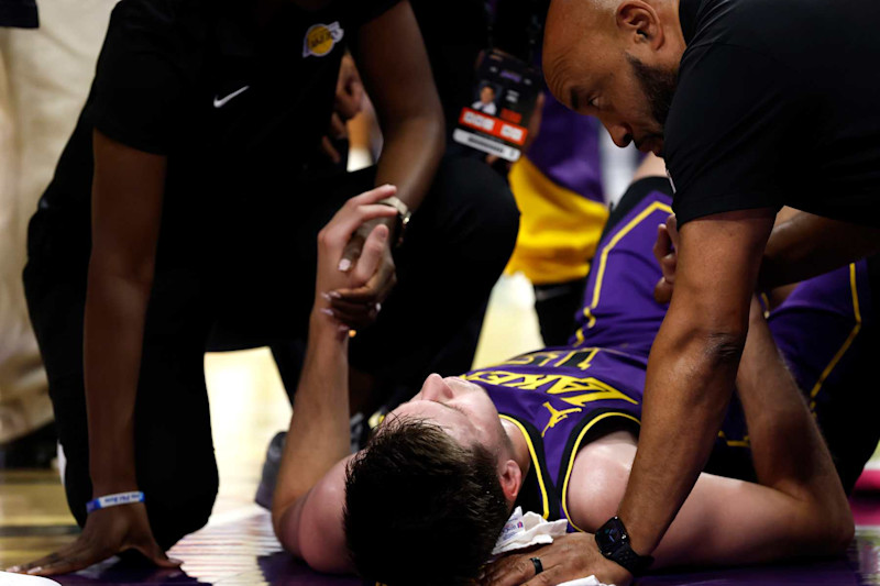 LOS ANGELES, CALIFORNIA - NOVEMBER 29: Austin Reaves #15 of the Los Angeles Lakers is treated after an apparent injury against the Oklahoma City Thunder during the second quarter of the Emirates NBA Cup at Crypto.com Arena on November 29, 2024 in Los Angeles, California. NOTE TO USER: User expressly acknowledges and agrees that, by downloading and or using this photograph, User is consenting to the terms and conditions of the Getty Images License Agreement. (Photo by Ronald Martinez/Getty Images)