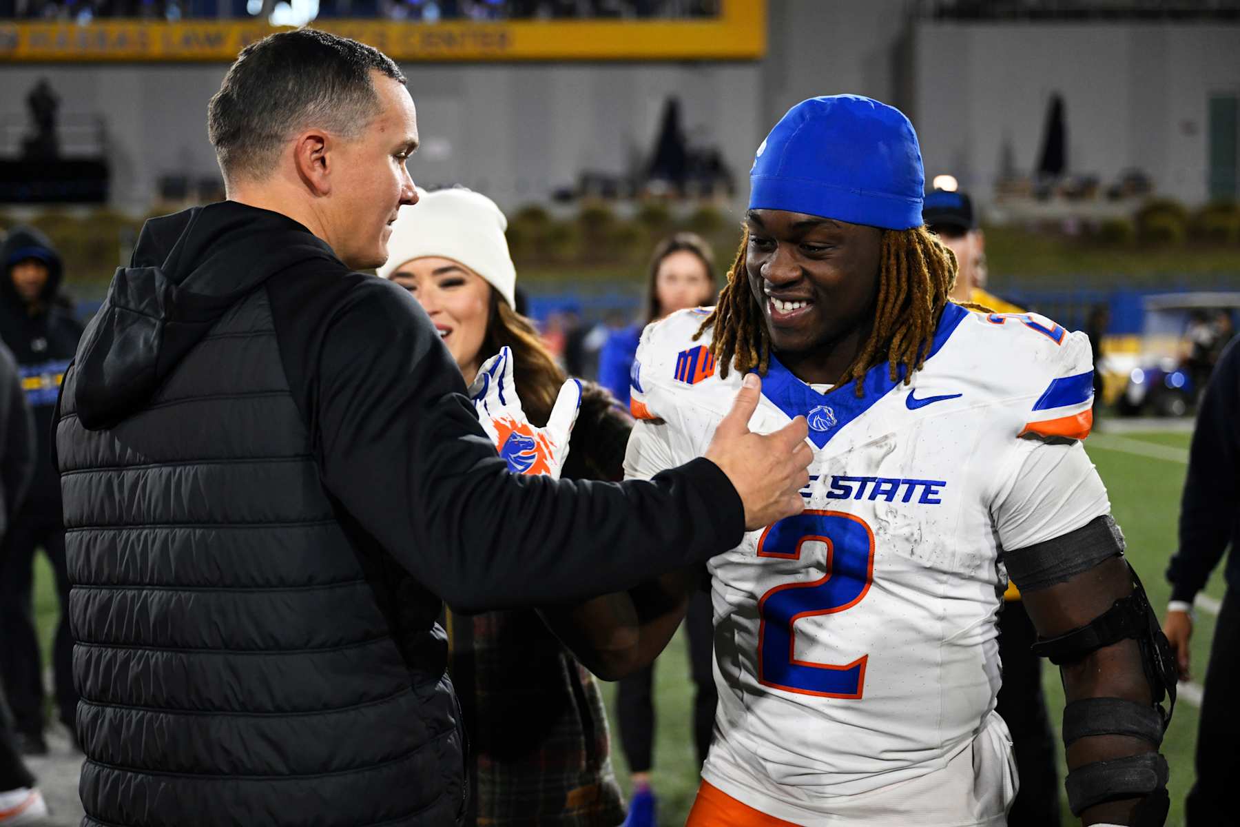 SAN JOSE, CALIFORNIA - NOVEMBER 16: Ashton Jeanty #2 of the Boise State Broncos and head coach Spencer Danielson celebrate their win over the San Jose State Spartans at CEFCU Stadium on November 16, 2024 in San Jose, California. (Photo by Eakin Howard/Getty Images)