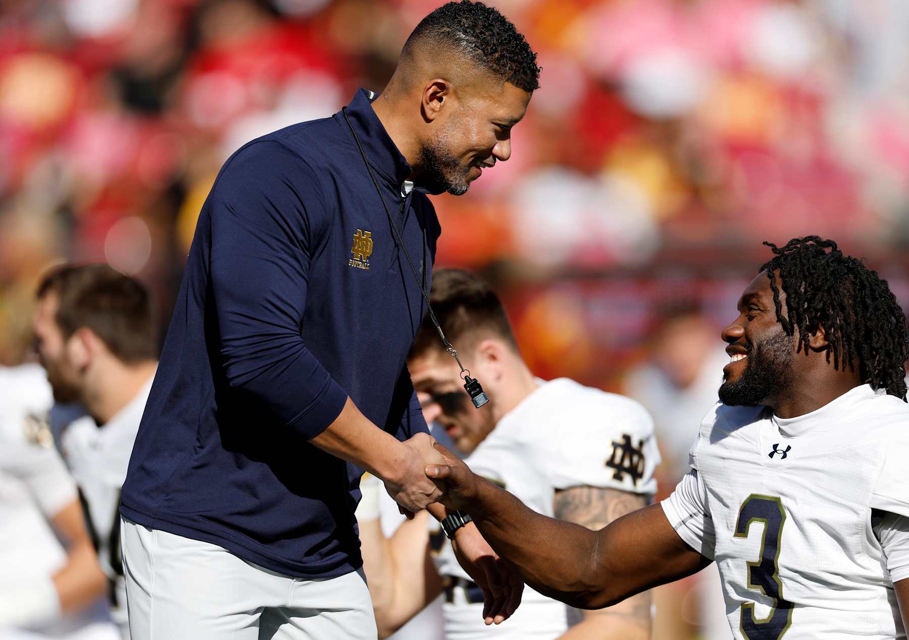 LOS ANGELES, CALIFORNIA - NOVEMBER 30: Head coach Marcus Freeman shake hands with linebacker Jaylen Sneed #3 of the Notre Dame Fighting Irish before the game against USC Trojans at United Airlines Field at the Los Angeles Memorial Coliseum on November 30, 2024 in Los Angeles, California. (Photo by Kevork Djansezian/Getty Images)