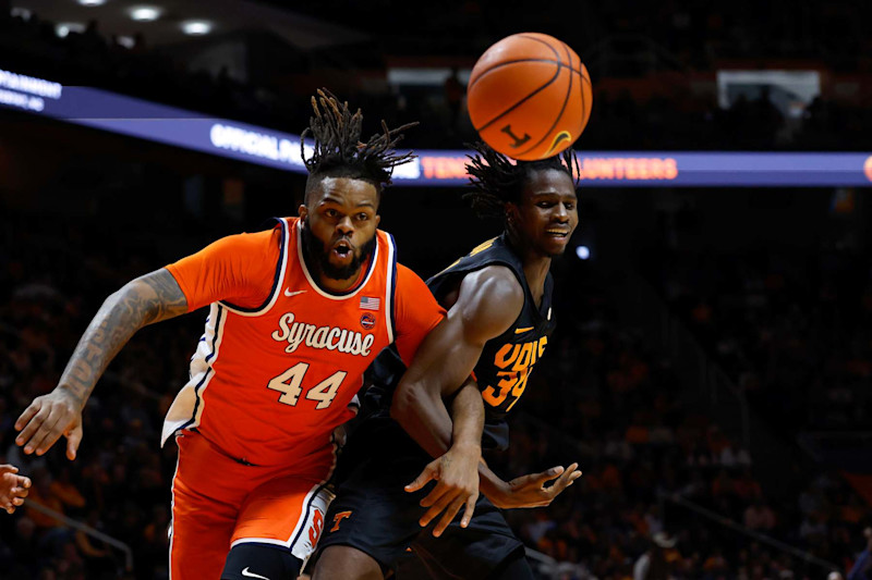 KNOXVILLE, TENNESSEE - DECEMBER 03: Eddie Lampkin Jr. #44 of the Syracuse Orange and Felix Okpara #34 of the Tennessee Volunteers battle for the ball during the first half of the game between the Tennessee Volunteers and the Syracuse Orange at Thompson-Boling Arena on December 03, 2024 in Knoxville, Tennessee.  (Photo by Johnnie Izquierdo/Getty Images)