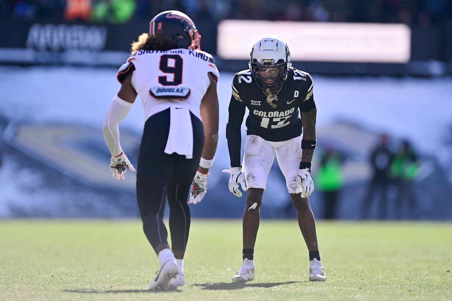 BOULDER, CO - NOVEMBER 29: Travis Hunter #12 of the Colorado Buffaloes lines up opposite Ayo Shotomide-King #9 of the Oklahoma State Cowboys in the third quarter at Folsom Field on November 29, 2024 in Boulder, Colorado. (Photo by Dustin Bradford/Getty Images)