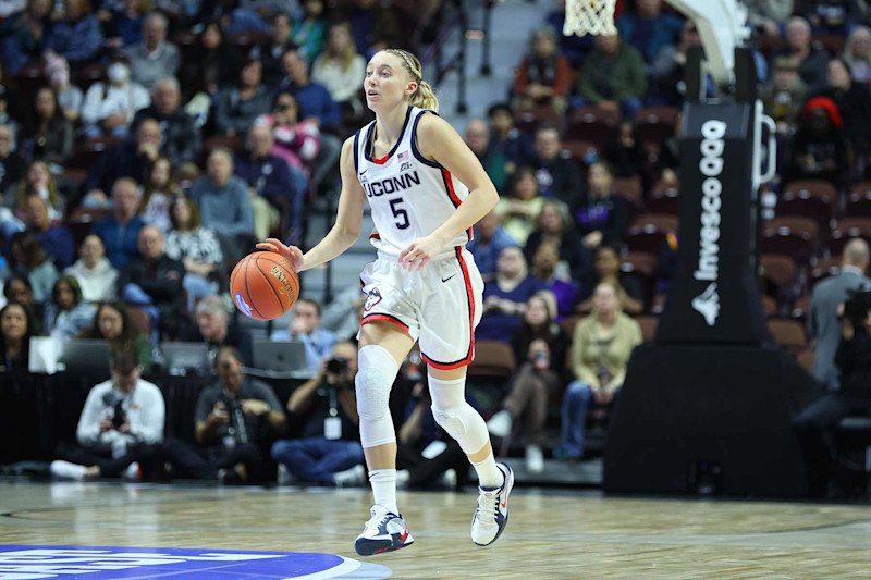 UNCASVILLE, CT - DECEMBER 17: UConn Huskies guard Paige Bueckers (5) dribbles the ball up court during the 2024 college Basketball Hall of Fame Women's Showcase game between Iowa State Cyclones and UConn Huskies on December 17, 2024, at Mohegan Sun Arena in Uncasville, CT. (Photo by M. Anthony Nesmith/Icon Sportswire via Getty Images)