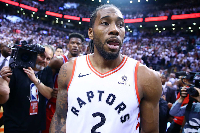 TORONTO, ON - MAY 12:  Kawhi Leonard #2 of the Toronto Raptors looks on after sinking a buzzer beater to win Game Seven of the second round of the 2019 NBA Playoffs against the Philadelphia 76ers at Scotiabank Arena on May 12, 2019 in Toronto, Canada.  NOTE TO USER: User expressly acknowledges and agrees that, by downloading and or using this photograph, User is consenting to the terms and conditions of the Getty Images License Agreement.  (Photo by Vaughn Ridley/Getty Images)