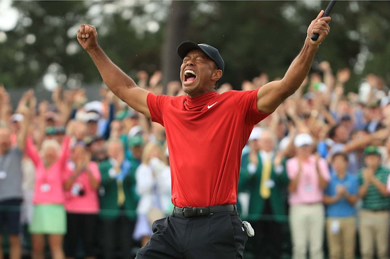 AUGUSTA, GEORGIA - APRIL 14: Tiger Woods (L) of the United States celebrates on the 18th green after winning the Masters at Augusta National Golf Club on April 14, 2019 in Augusta, Georgia. (Photo by Andrew Redington/Getty Images)