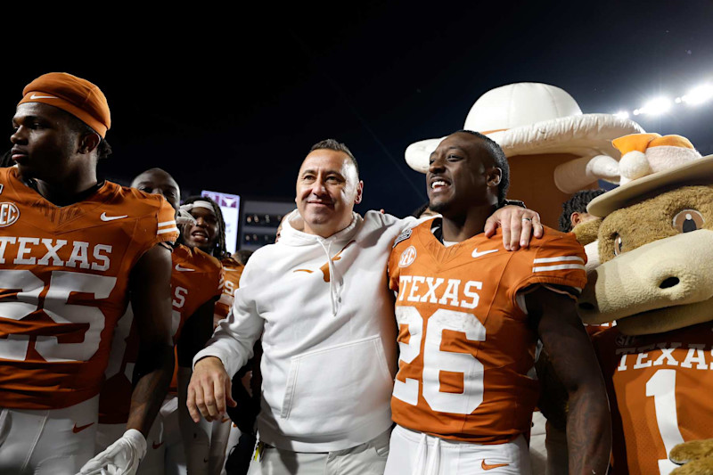 AUSTIN, TEXAS - DECEMBER 21: Head coach Steve Sarkisian of the Texas Longhorns celebrates with Quintrevion Wisner #26 and teammates after defeating the Clemson Tigers 38-24 in the Playoff First Round Game at Darrell K Royal-Texas Memorial Stadium on December 21, 2024 in Austin, Texas. (Photo by Tim Warner/Getty Images)