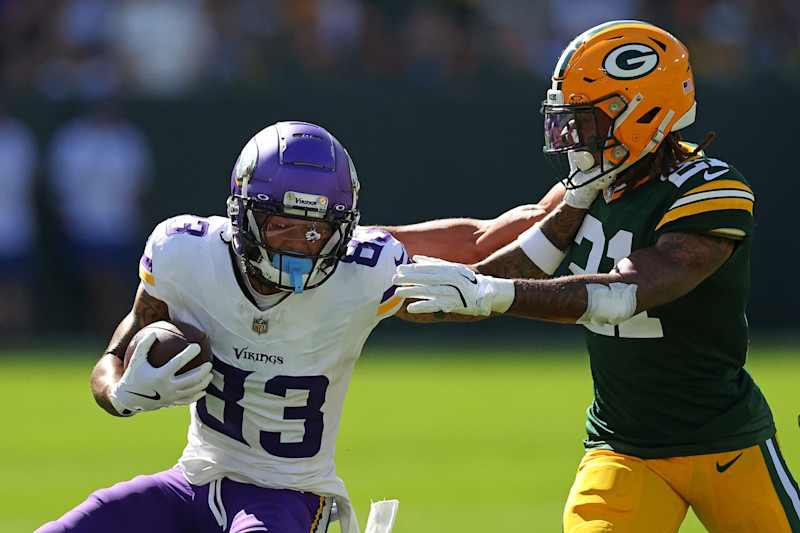 GREEN BAY, WISCONSIN - SEPTEMBER 29: Jalen Nailor #83 of the Minnesota Vikings is pursued by Eric Stokes #21 of the Green Bay Packers during a game at Lambeau Field on September 29, 2024 in Green Bay, Wisconsin. (Photo by Stacy Revere/Getty Images)