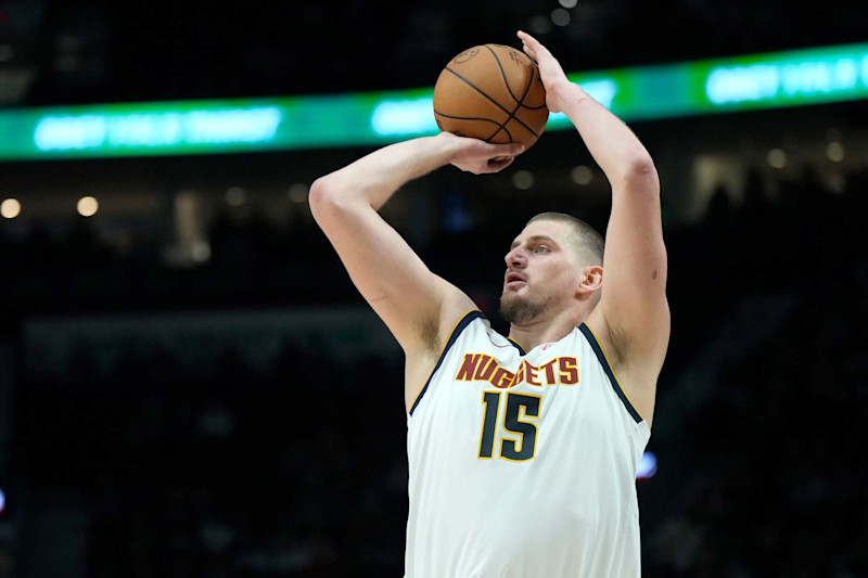 PORTLAND, OREGON - DECEMBER 19: Nikola Jokic #15 of the Denver Nuggets shoots a three point basket during the first half against the Portland Trail Blazers at Moda Center on December 19, 2024 in Portland, Oregon. NOTE TO USER: User expressly acknowledges and agrees that, by downloading and or using this photograph, User is consenting to the terms and conditions of the Getty Images License Agreement. (Photo by Soobum Im/Getty Images)