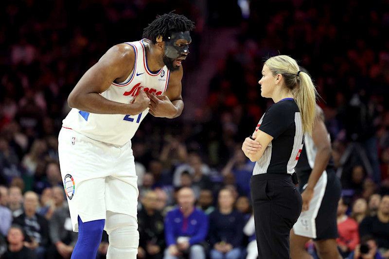 PHILADELPHIA, PENNSYLVANIA - DECEMBER 23: Joel Embiid #21 of the Philadelphia 76ers argues a call with referee Jenna Schroeder #20 during the first half against the San Antonio Spurs at the Wells Fargo Center on December 23, 2024 in Philadelphia, Pennsylvania. Embiid was ejected from the game with two technical fouls. NOTE TO USER: User expressly acknowledges and agrees that, by downloading and or using this photograph, User is consenting to the terms and conditions of the Getty Images License Agreement. (Photo by Emilee Chinn/Getty Images)