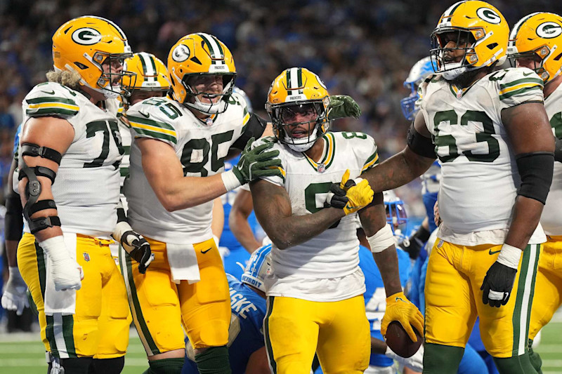 DETROIT, MICHIGAN - DECEMBER 05: Josh Jacobs #8 of the Green Bay Packers celebrates with Tucker Kraft #85 and Rasheed Walker #63 after scoring a 4 yard touchdown against the Detroit Lions during the fourth quarter in the game at Ford Field on December 05, 2024 in Detroit, Michigan. (Photo by Nic Antaya/Getty Images)