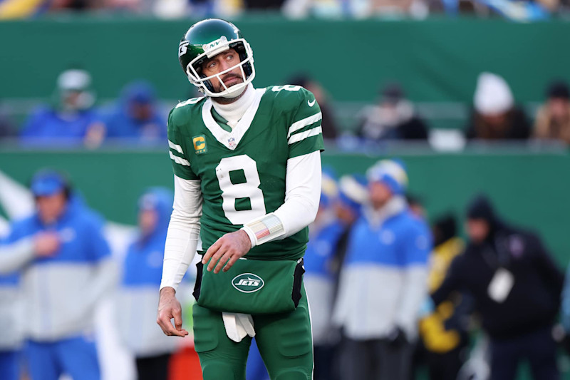 EAST RUTHERFORD, NEW JERSEY - DECEMBER 22: Aaron Rodgers #8 of the New York Jets reacts after being sacked and fumbling the ball during the fourth quarter against the Los Angeles Rams at MetLife Stadium on December 22, 2024 in East Rutherford, New Jersey. (Photo by Emilee Chinn/Getty Images)