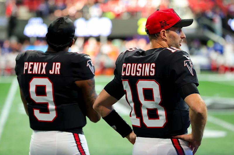 ATLANTA, GEORGIA - DECEMBER 22: Michael Penix Jr. #9 and Kirk Cousins #18 of the Atlanta Falcons look on from the sideline during the fourth quarter against the New York Giants at Mercedes-Benz Stadium on December 22, 2024 in Atlanta, Georgia. (Photo by Kevin C. Cox/Getty Images)