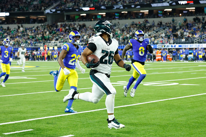 INGLEWOOD, CALIFORNIA - NOVEMBER 24: Saquon Barkley #26 of the Philadelphia Eagles runs for a touchdown during the third quarter against the Los Angeles Rams at SoFi Stadium on November 24, 2024 in Inglewood, California. (Photo by Ronald Martinez/Getty Images)