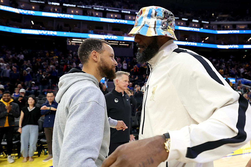 SAN FRANCISCO, CALIFORNIA - OCTOBER 18: Stephen Curry #30 of the Golden State Warriors talks with LeBron James #23 of the Los Angeles Lakers after their preseason game at Chase Center on October 18, 2024 in San Francisco, California.  NOTE TO USER: User expressly acknowledges and agrees that, by downloading and/or using this photograph, user is consenting to the terms and conditions of the Getty Images License Agreement.  (Photo by Ezra Shaw/Getty Images)