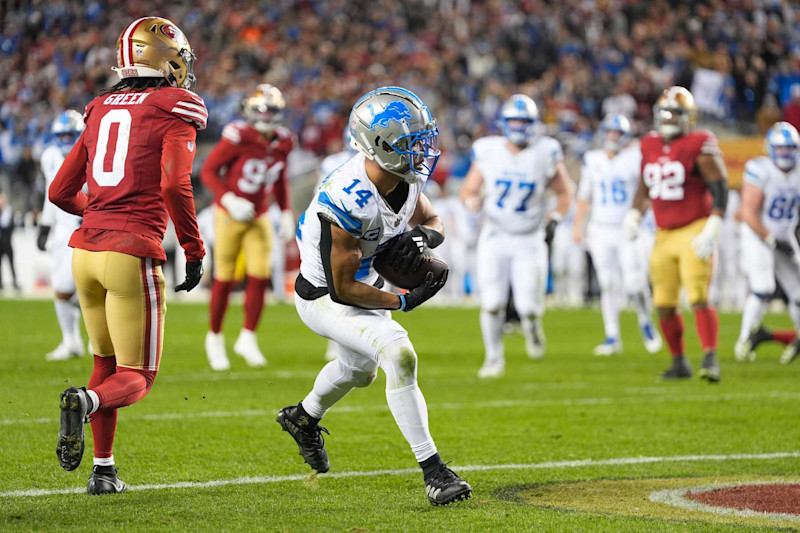 SANTA CLARA, CALIFORNIA - DECEMBER 30: Amon-Ra St. Brown #14 of the Detroit Lions scores a receiving touchdown past Renardo Green #0 of the San Francisco 49ers during the third quarter at Levi's Stadium on December 30, 2024 in Santa Clara, California. (Photo by Thearon W. Henderson/Getty Images)