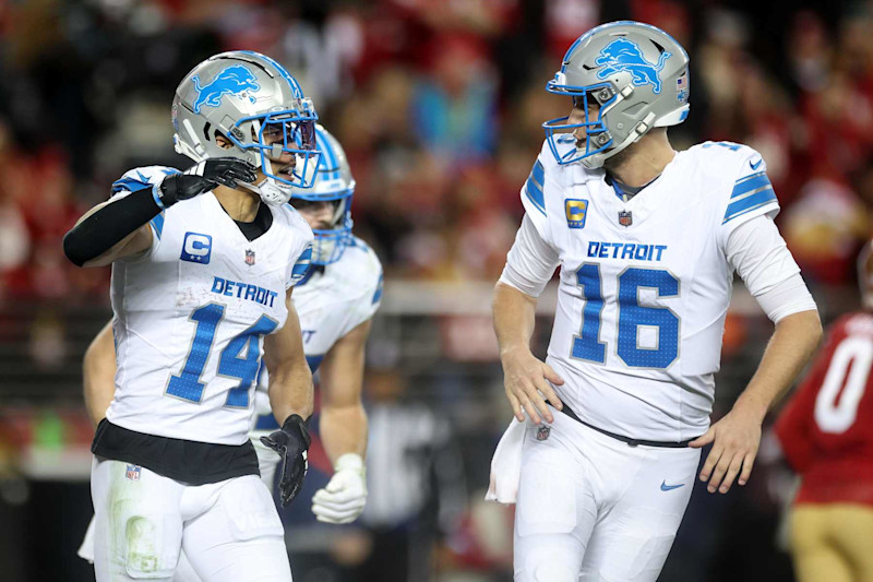 SANTA CLARA, CALIFORNIA - DECEMBER 30: Jared Goff #16 and Amon-Ra St. Brown #14 of the Detroit Lions celebrate their touchdown connection against the San Francisco 49ers during the third quarter at Levi's Stadium on December 30, 2024 in Santa Clara, California. (Photo by Ezra Shaw/Getty Images)