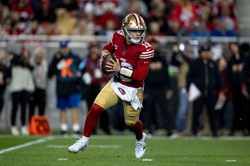 SANTA CLARA, CALIFORNIA - DECEMBER 30: Brock Purdy #13 of the San Francisco 49ers scrambles and looks to pass during an NFL Football game against the Detroit Lions at Levi's Stadium on December 30, 2024 in Santa Clara, California. (Photo by Michael Owens/Getty Images)