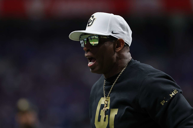 SAN ANTONIO, TX - DECEMBER 28: Colorado Buffaloes head coach Deion Sanders on the field before the football game between BYU Cougars and Colorado Buffalos on December 28, 2024, at the Alamodome in San Antonio, Texas. (Photo by David Buono/Icon Sportswire via Getty Images)