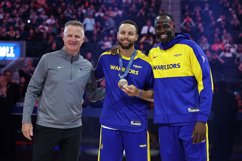 SAN FRANCISCO, CALIFORNIA - OCTOBER 11:  Golden State Warriors head coach Steve Kerr, from left, Stephen Curry #30 and Draymond Green #23 pose for photos during an Olympic Gold Medal recognition ceremony before their preseason game against the Sacramento Kings at Chase Center on October 11, 2024 in San Francisco, California.  NOTE TO USER: User expressly acknowledges and agrees that, by downloading and/or using this photograph, user is consenting to the terms and conditions of the Getty Images License Agreement.  (Photo by Ezra Shaw/Getty Images)