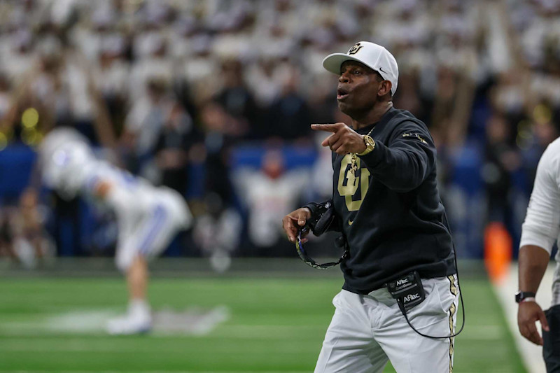 SAN ANTONIO, TX - DECEMBER 28: Colorado Buffaloes head coach Deion Sanders yells to players on the field during the football game between BYU Cougars and Colorado Buffalos on December 28, 2024, at the Alamodome in San Antonio, Texas. (Photo by David Buono/Icon Sportswire via Getty Images)