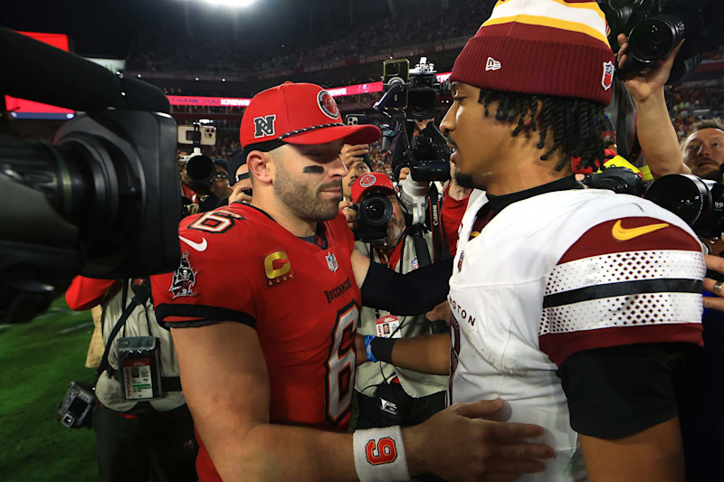 TAMPA, FLORIDA - JANUARY 12: Baker Mayfield #6 of the Tampa Bay Buccaneers congratulates Jayden Daniels #5 of the Washington Commanders after the NFC Wild Card Playoff at Raymond James Stadium on January 12, 2025 in Tampa, Florida. (Photo by Mike Ehrmann/Getty Images)