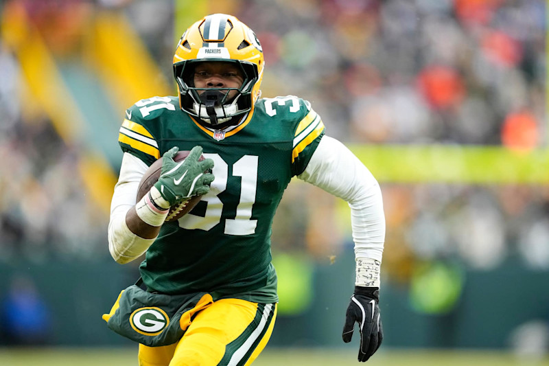 GREEN BAY, WISCONSIN - JANUARY 05: Emanuel Wilson #31 of the Green Bay Packers runs with the ball in the fourth quarter against the Chicago Bears at Lambeau Field on January 05, 2025 in Green Bay, Wisconsin. (Photo by Patrick McDermott/Getty Images)