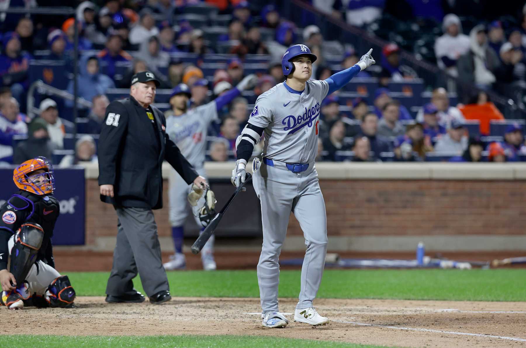 NEW YORK, NEW YORK - OCTOBER 16: (NEW YORK DAILIES OUT)  Shohei Ohtani #17 of the Los Angeles Dodgers follows through on his eighth inning three run home run against the New York Mets during Game Three of the National League Championship Series at Citi Field on October 16, 2024 in New York City. (Photo by Jim McIsaac/Getty Images)