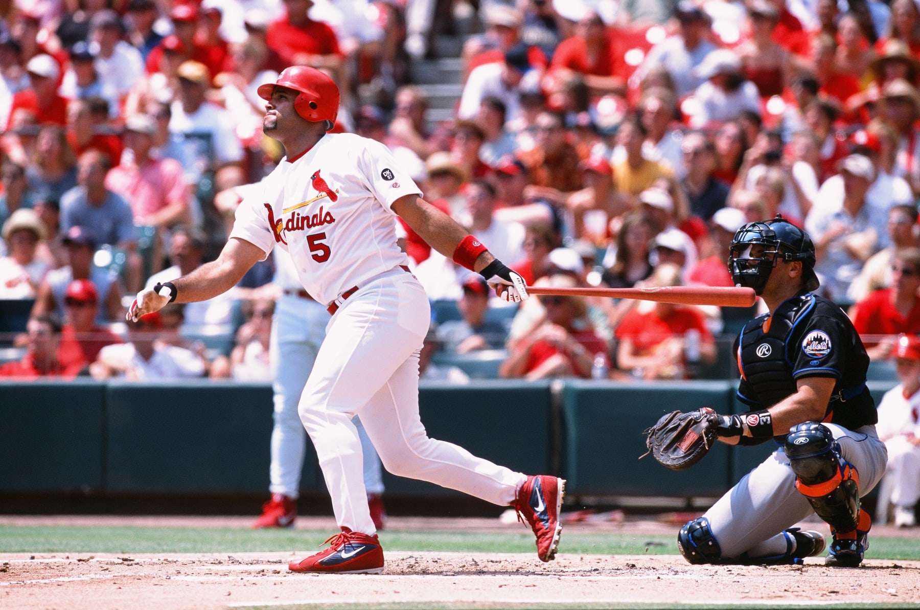 ST. LOUIS, MO - AUGUST 10: Albert Pujols of the St. Louis Cardinals bats against the New York Mets at Busch Stadium on August 10, 2002 in St. Louis, Missouri. The Cardinals defeated the Mets 5-4. (Photo by Sporting News via Getty Images via Getty Images) 