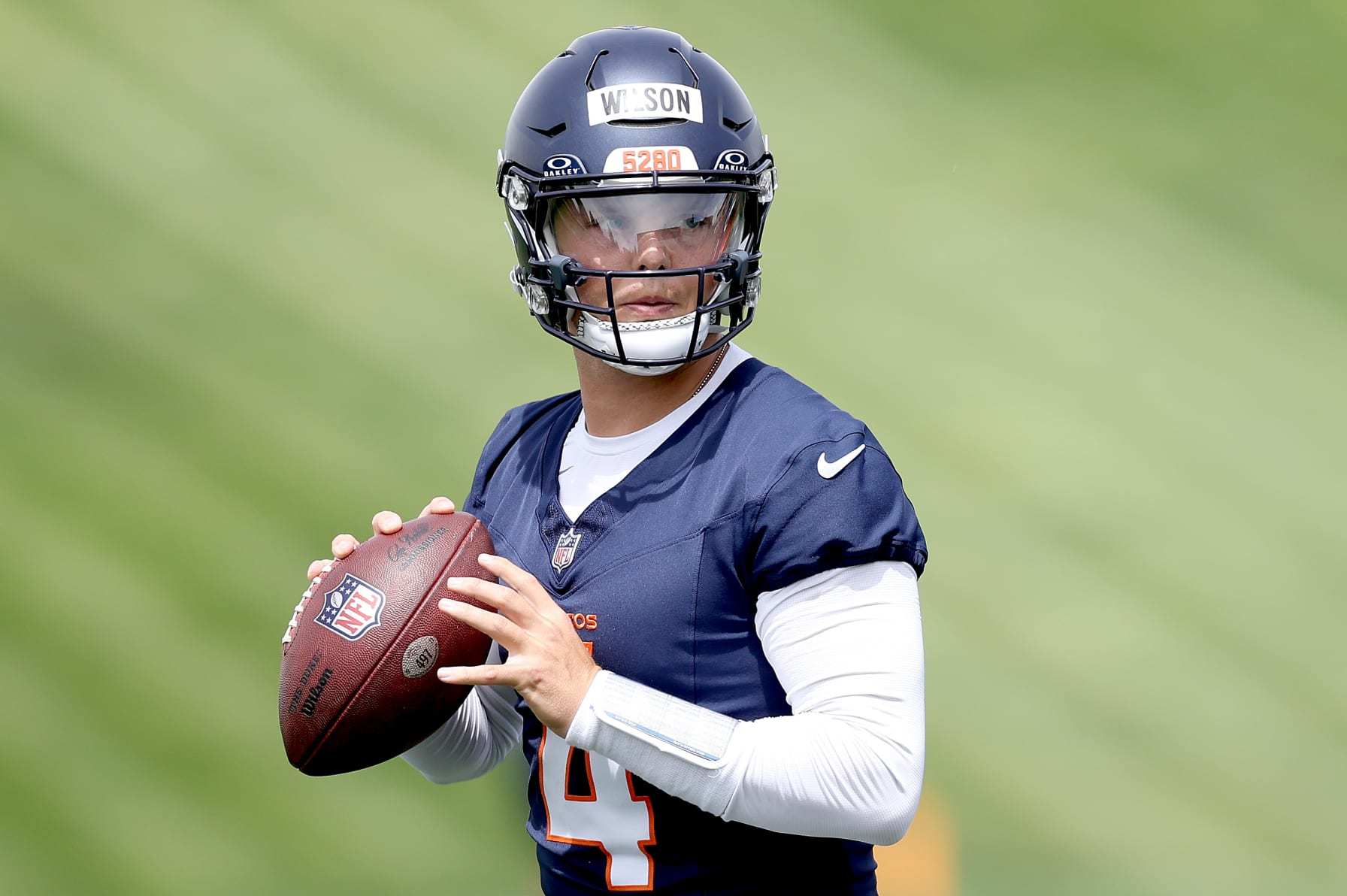 ENGLEWOOD, COLORADO - JUNE 04: Quarterback Zach Wilson #4 of the Denver Broncos throws during Denver Broncos OTA Offseason Workouts at Centura Health Training Center on June 04, 2024 in Englewood, Colorado. (Photo by Matthew Stockman/Getty Images)