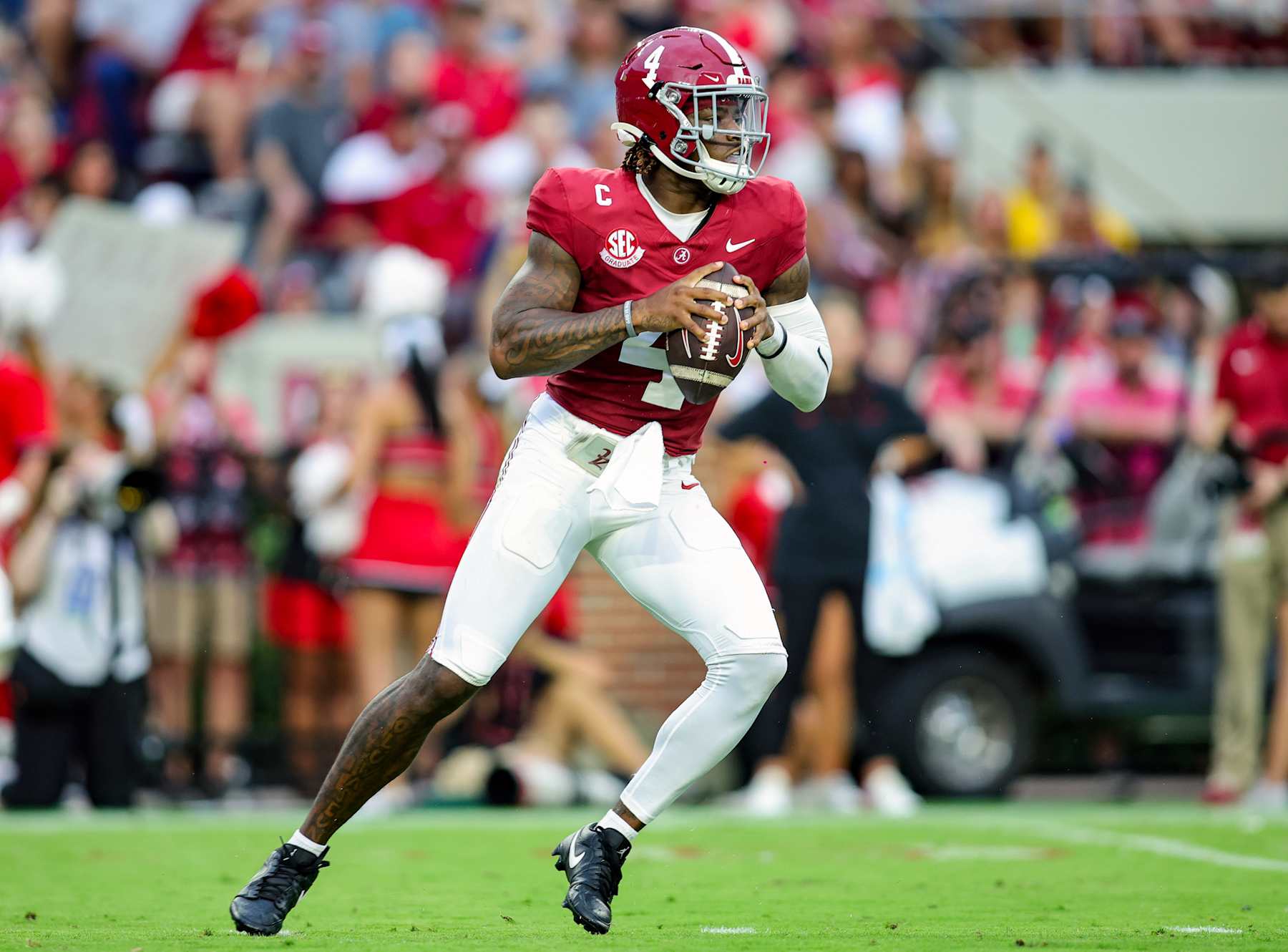 TUSCALOOSA, ALABAMA - AUGUST 31: Jalen Milroe #4 of the Alabama Crimson Tide drops back to pass during the first half against the Western Kentucky Hilltoppers at Bryant-Denny Stadium on August 31, 2024 in Tuscaloosa, Alabama. (Photo by Brandon Sumrall/Getty Images)