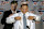 DETROIT, MI - FEBRUARY 2: Detroit Tigers' General Manager and team President David Dombrowski (L) helps Ivan "Pudge" Rodriguez put on his new Detroit Tigers uniform on February 1, 2004 at Comerica Park in Detroit, Michigan. Rodriguez signed a four year, approximately $40 million contract with the Tigers. (Photo by Bill Pugliano/Getty Images)
