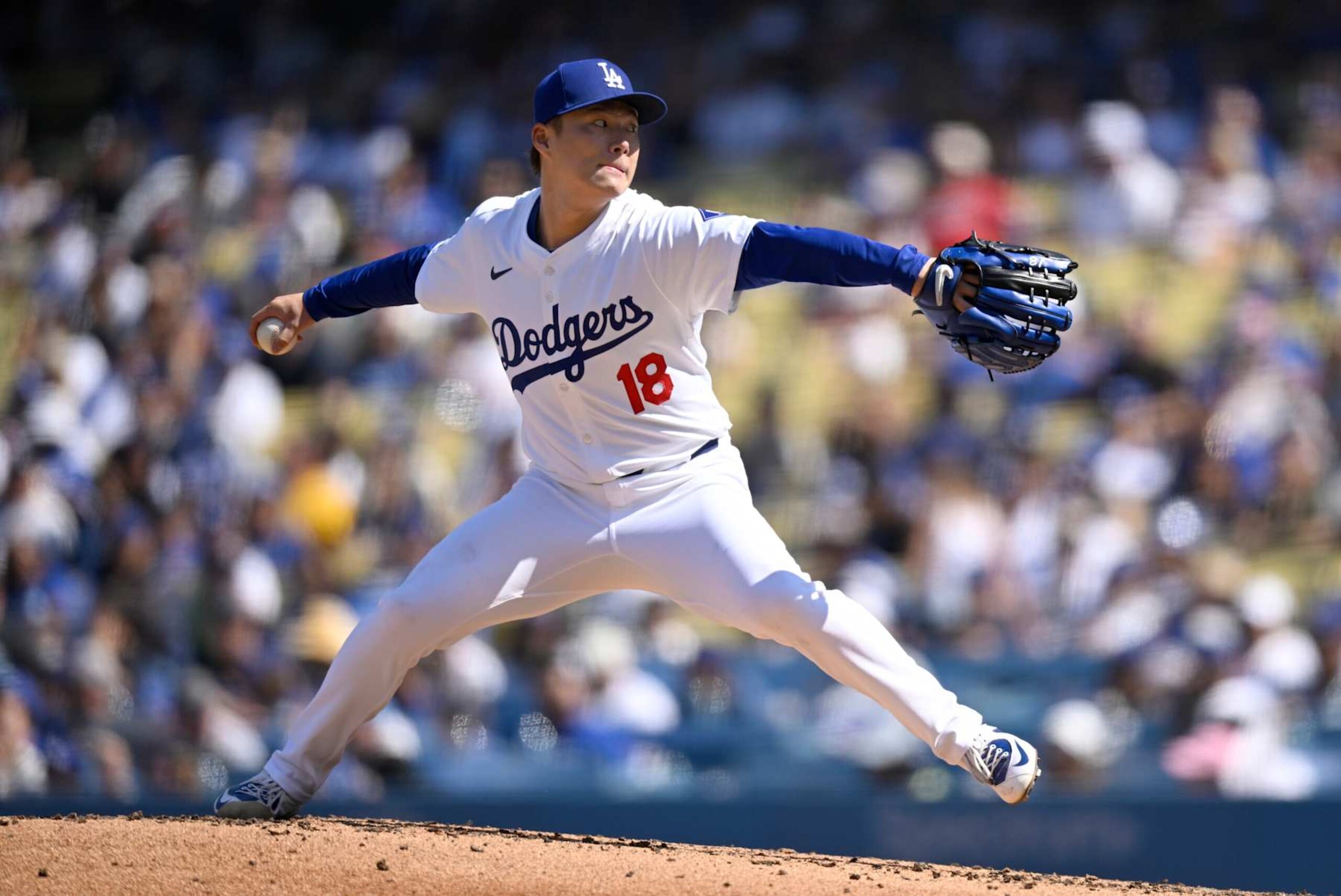 LOS ANGELES, CALIFORNIA - SEPTEMBER 22: Yoshinobu Yamamoto #18 of the Los Angeles Dodgers pitches against the Colorado Rockies in the third inning against the Colorado Rockies at Dodger Stadium on September 22, 2024 in Los Angeles, California. (Photo by John McCoy/Getty Images)