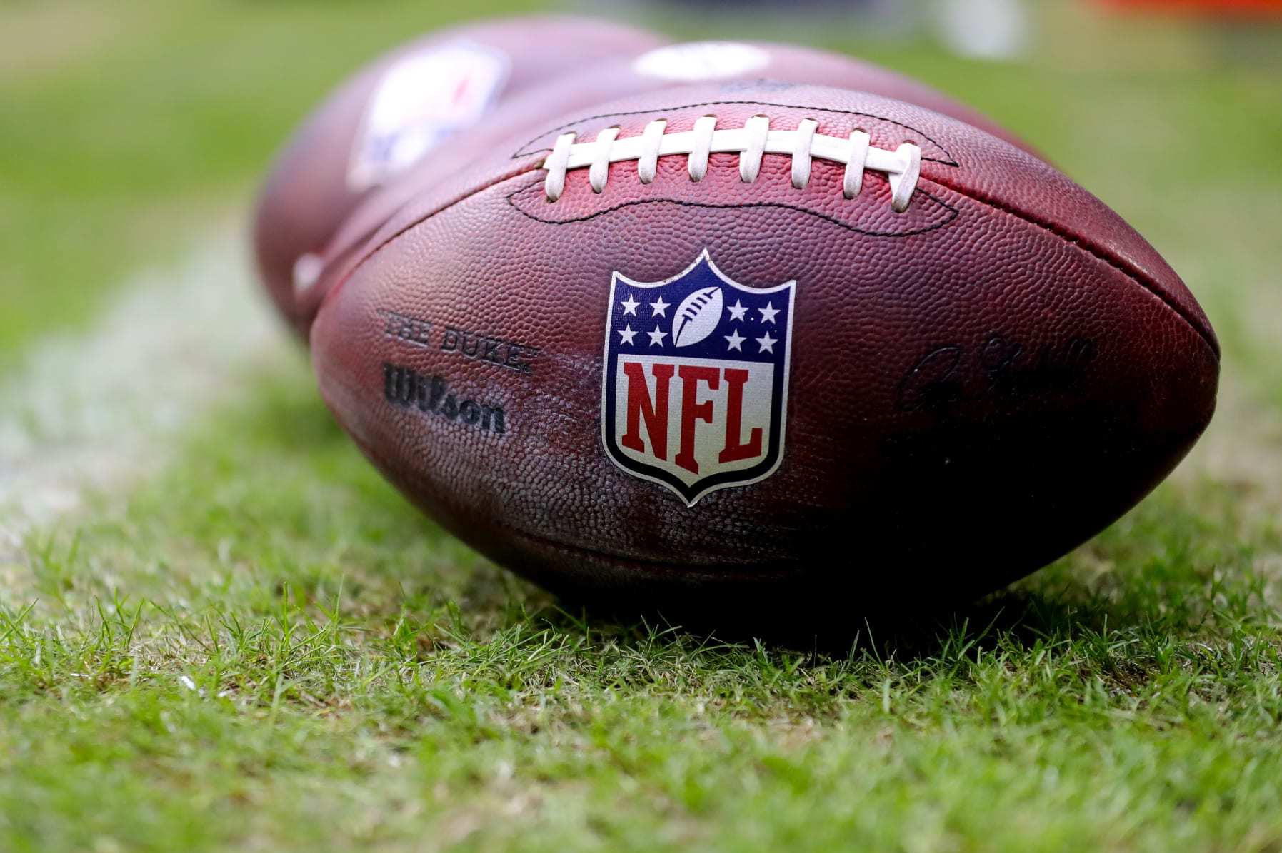 MIAMI GARDENS, FLORIDA - NOVEMBER 27: A detailed view of the NFL logo on a Wilson football prior to a game between the Houston Texans and Miami Dolphins at Hard Rock Stadium on November 27, 2022 in Miami Gardens, Florida. (Photo by Megan Briggs/Getty Images)